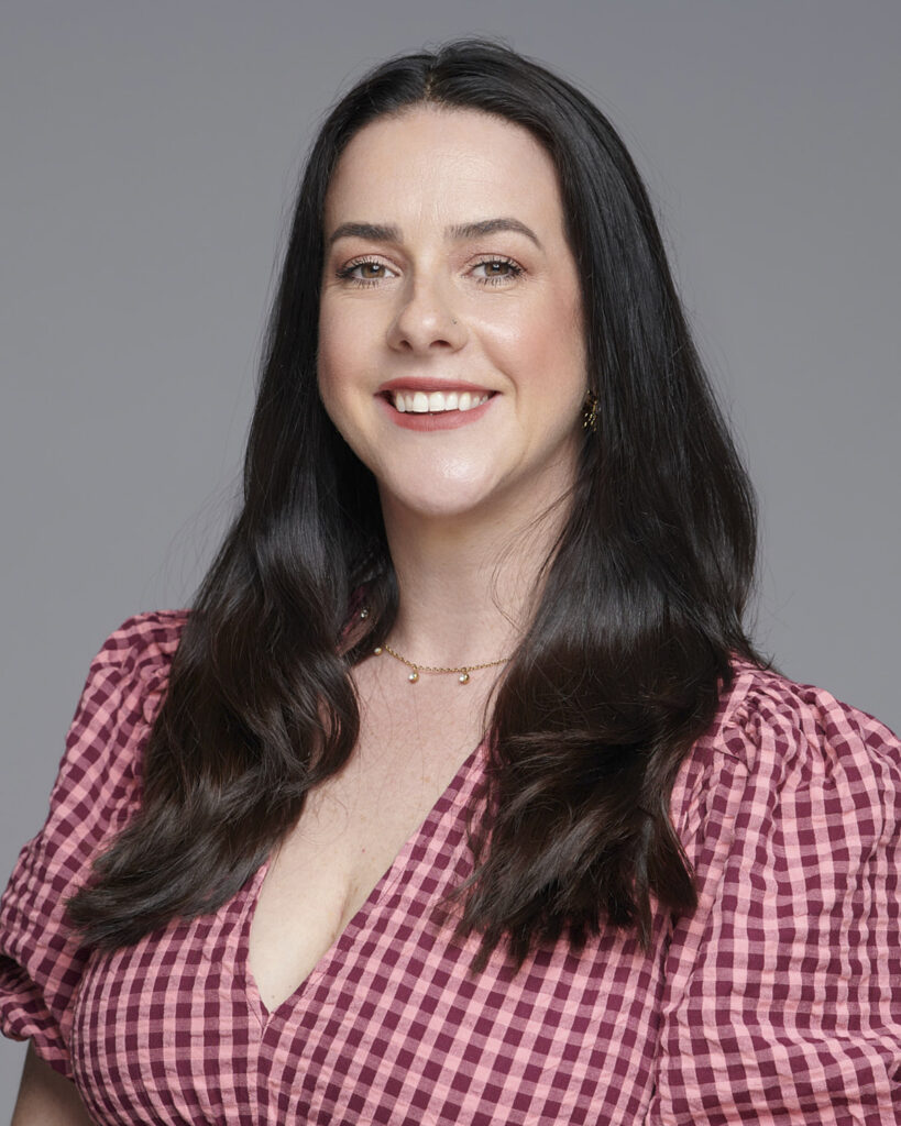 Professional business headshot of a woman working in the corporate industry, photographed in a London studio with a neutral backdrop.
