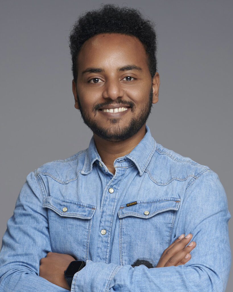 Professional business headshot of a man, photographed in a London studio with a neutral backdrop.