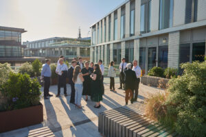 Guests networking during an LSEG rooftop drinks reception in London, enjoying evening sun and informal conversations – image by Collective Images
