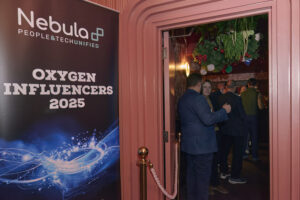 Entrance to the Nebula People & Tech Unified Oxygen Influencers 2025 event with a large banner and guests entering the venue